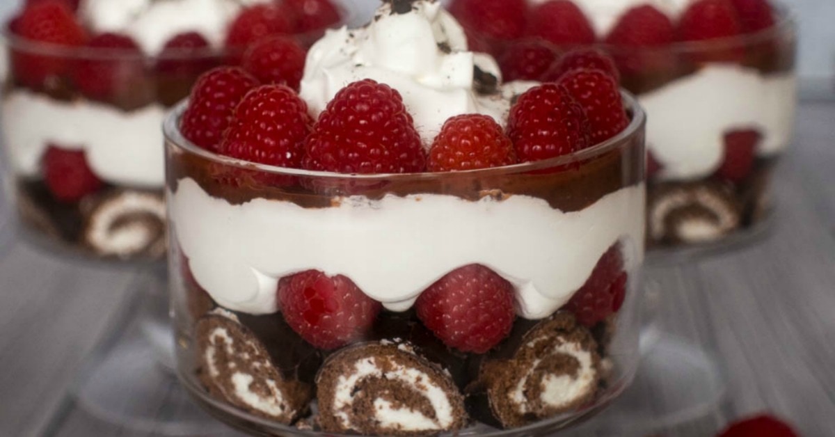 No bake dessert trifle with Ho Hos, raspberries, pudding and whipped topping.